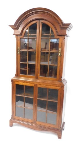 Appraisal: A thC mahogany display cabinet with an arched top with