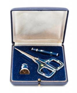 Appraisal: A German Silver and Enamel Three-Piece Sewing Kit comprising scissors