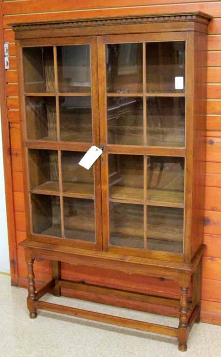 Appraisal: AN OAK CABINET BOOKCASE ON STAND English early th century