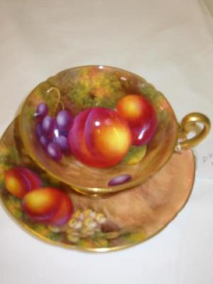 Appraisal: A ROYAL WORCESTER PORCELAIN TEA CUP AND SAUCER painted with