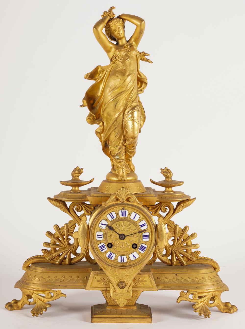 Appraisal: FRENCH GILT METAL FIGURAL MANTEL CLOCKunsigned inches wide inches deep