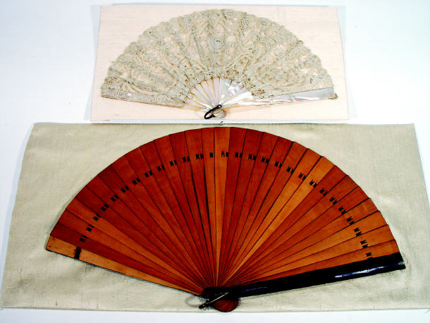 Appraisal: Lacework fan with mother of pearl guardsticks together with unusual