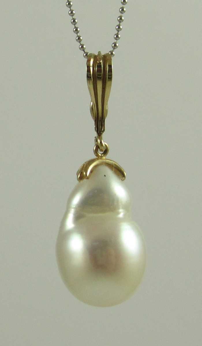 Appraisal: PEARL AND FOURTEEN KARAT GOLD PENDANT NECKLACE suspended on a