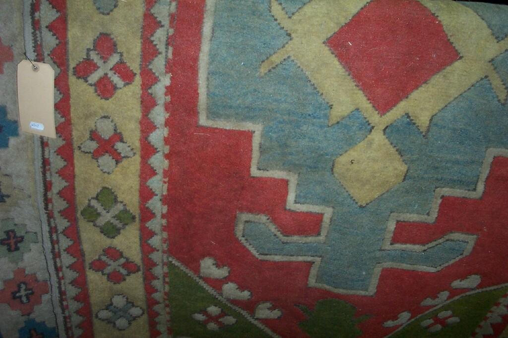 Appraisal: Two Eastern wool rugs with polychrome stylised floral and geometric