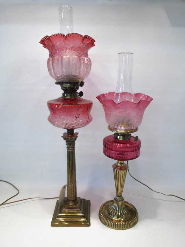 Appraisal: TWO VICTORIAN GLASS TABLE LAMPS each formerly fluid oil lamps