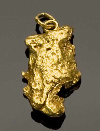 Appraisal: Gold Nugget Pendant AustraliaAn attractive water worn nugget of quintessential