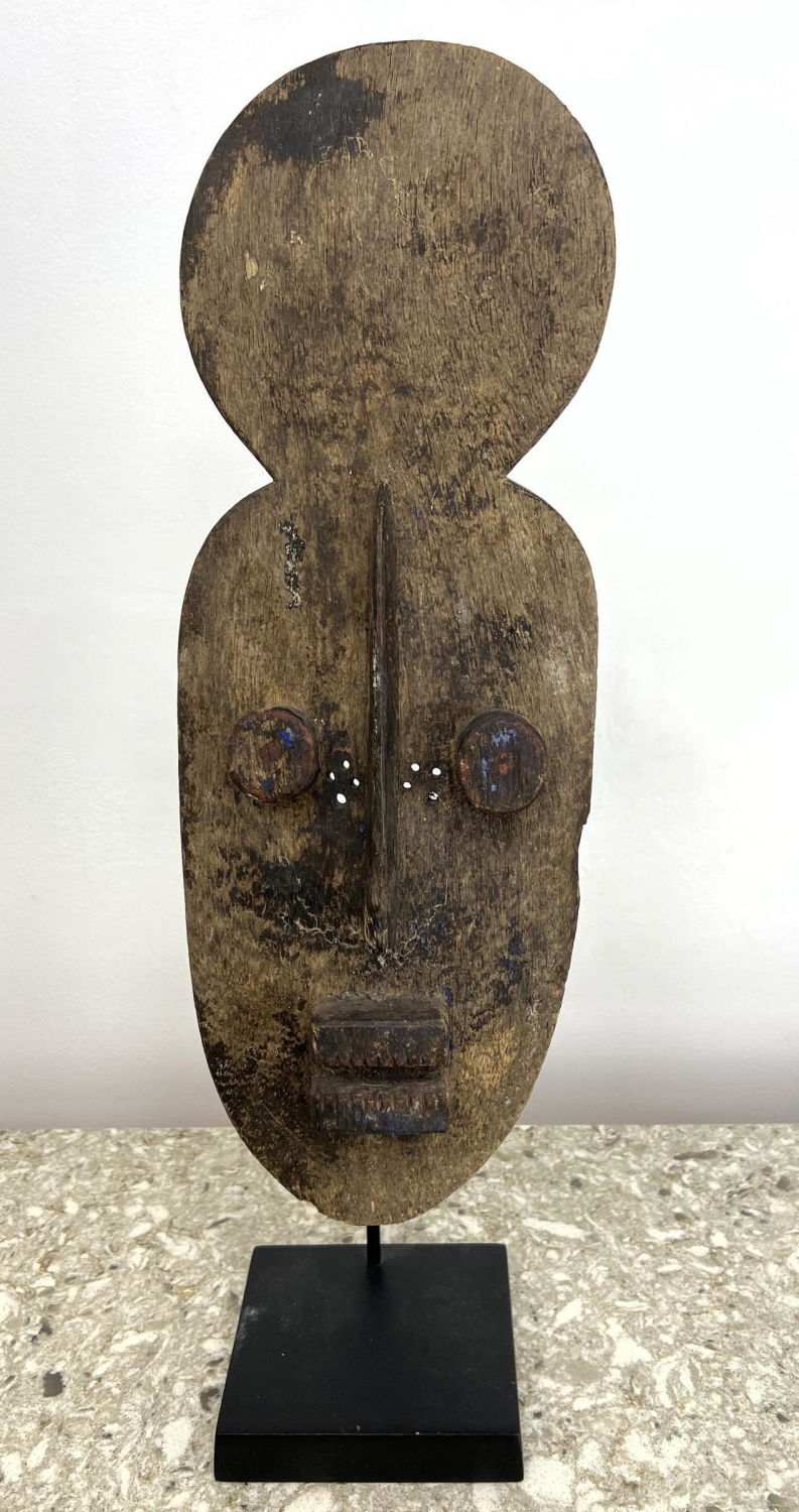 Appraisal: African tribal mask on custom stand Dimensions H inches W