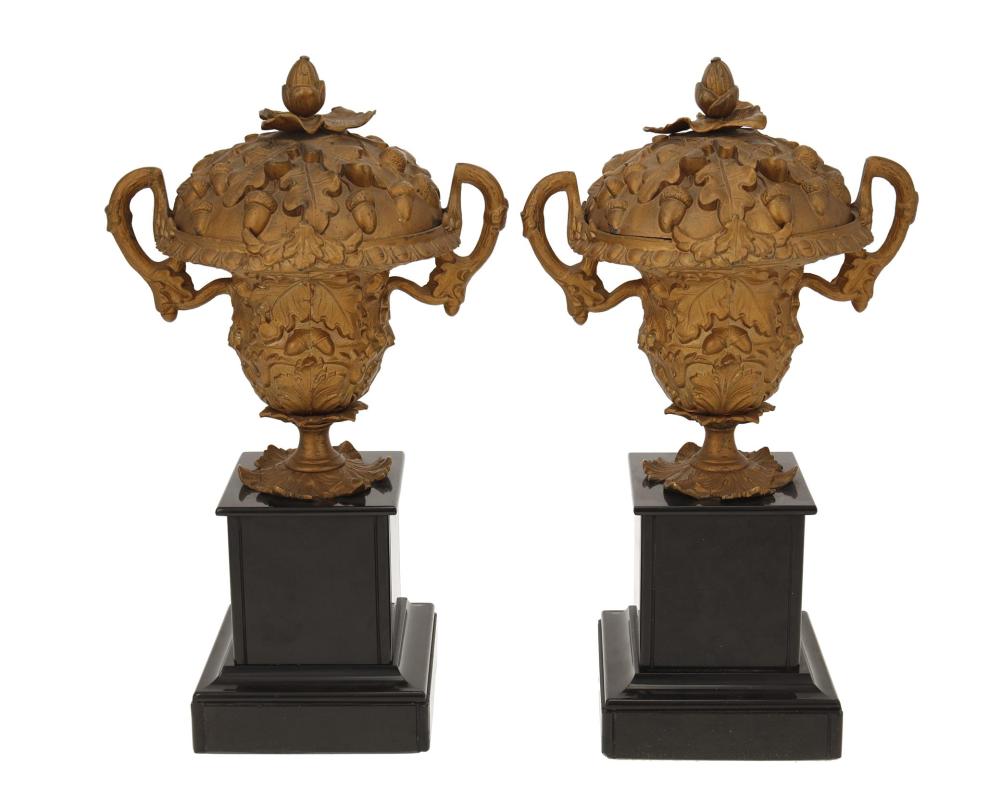 Appraisal: A PAIR OF GILT-METAL LIDDED URNSA pair of gilt-metal lidded