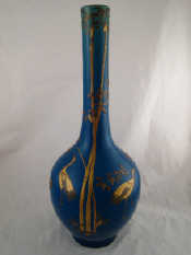 Appraisal: A tall necked Chinese turquoise vase with applied bronze and