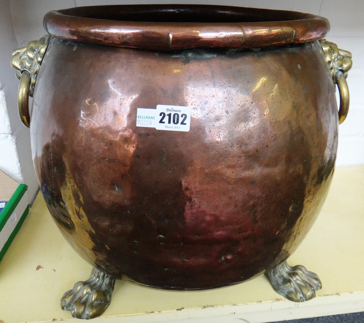 Appraisal: A copper and brass cauldron shaped log basket th century