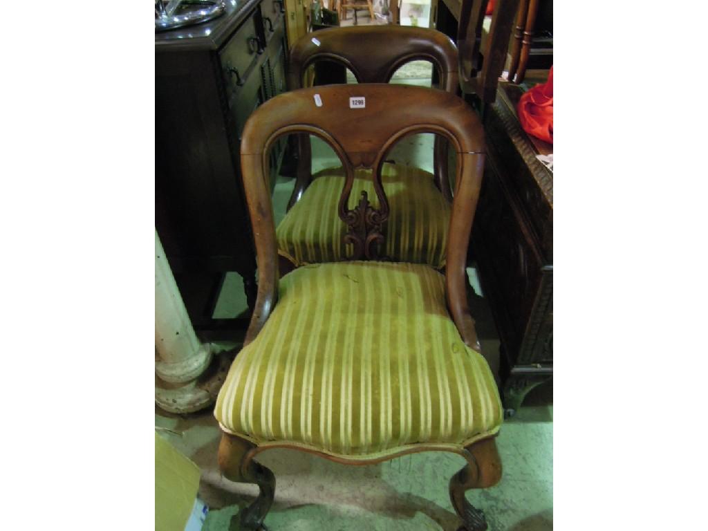 Appraisal: A pair of Victorian mahogany balloonback occasional chairs with carved