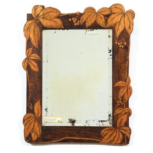 Appraisal: An Edwardian stained and penwork decorated wood mirror with leaves