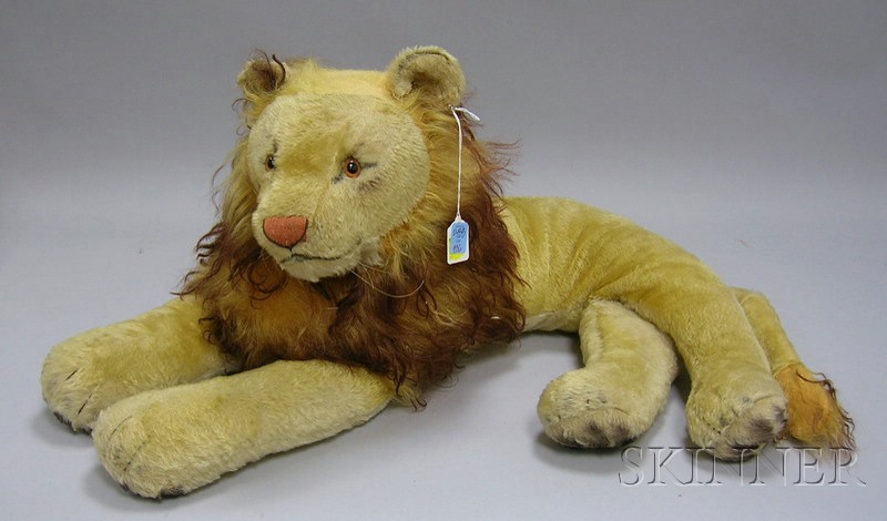 Appraisal: Steiff Mohair and Plush Recumbent Lion with ear button worn