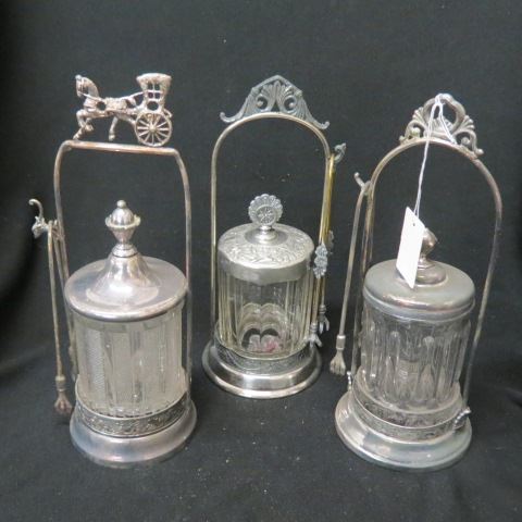 Appraisal: Victorian Pickle Castors clear pattern glass inserts silverplate holders with