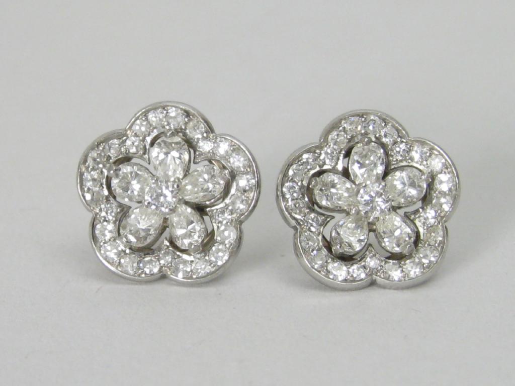 Appraisal: A pair of Diamond Earrings each with central circular-cut stone