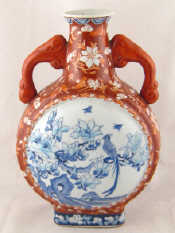 Appraisal: A ceramic Chinese moon flask in tan glaze with roundels