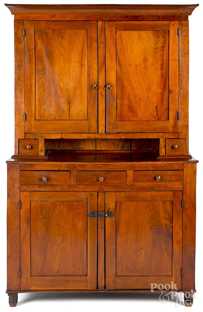 Appraisal: Pennsylvania walnut Dutch cupboard mid th c Pennsylvania walnut Dutch