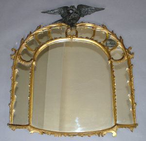 Appraisal: A giltwood wall mirror th century the top surmounted by