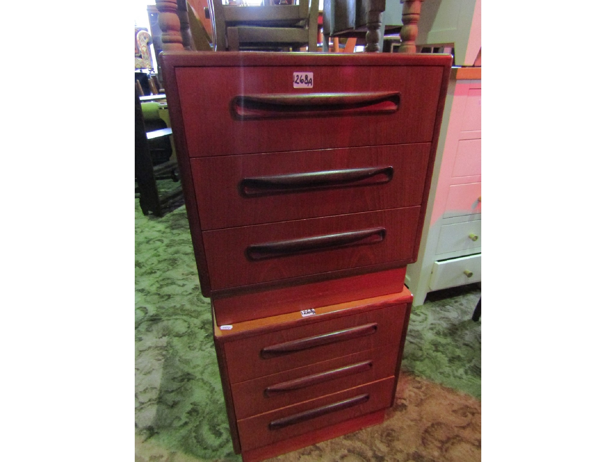 Appraisal: A pair of G plan teak three drawer bedside chests