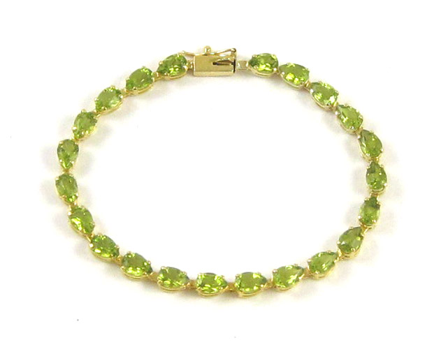 Appraisal: PERIDOT AND FOURTEEN KARAT GOLD BRACELET - inches in length