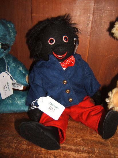 Appraisal: A Steiff 'Golly Boy' in blue jacket and red trousers