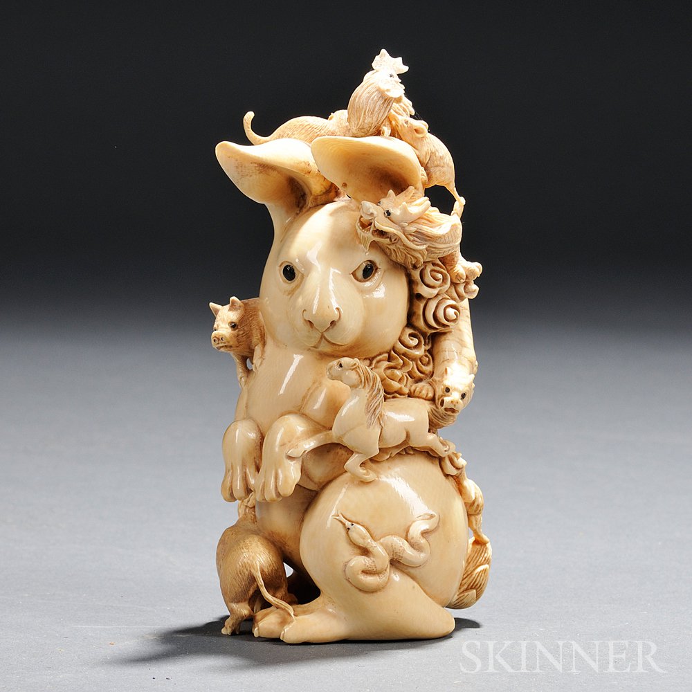 Appraisal: Ivory Carving Japan th century Zodiac group with inlaid eyes