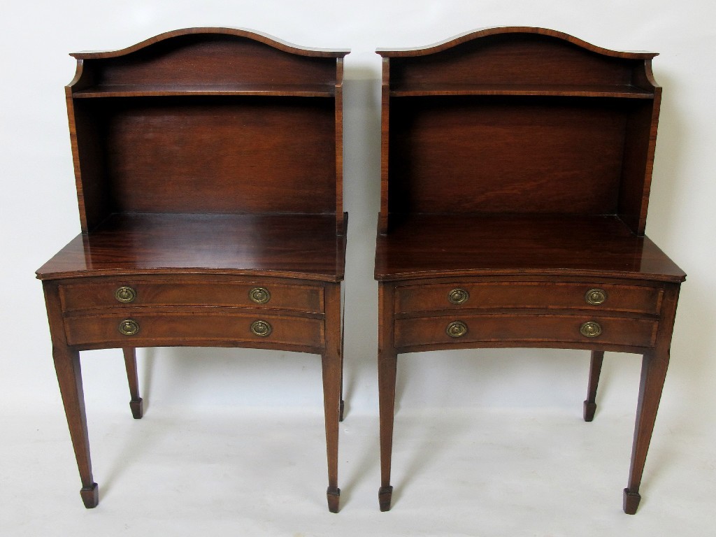 Appraisal: A pair of Edwardian mahogany bedside tables with arched open