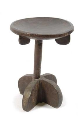 Appraisal: An East African ebonised wood stool a circular seat with