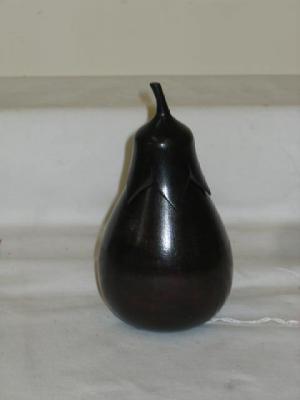 Appraisal: A FRUITWOOD TEA CADDY modelled as an aubergine the screw-off