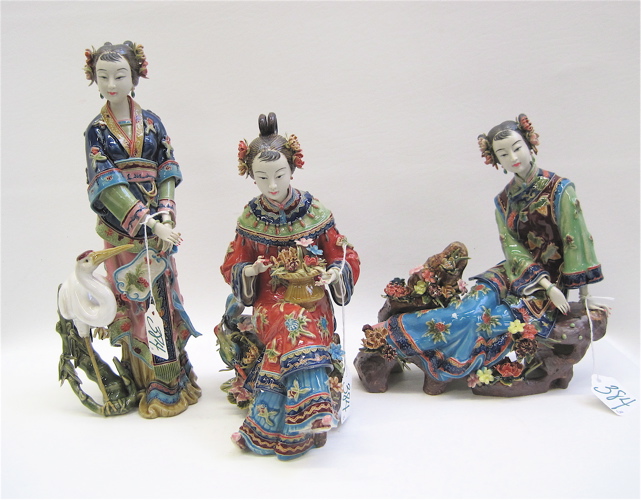 Appraisal: THREE CHINESE POTTERY FIGURAL SCULPTURES young women in traditional costumes