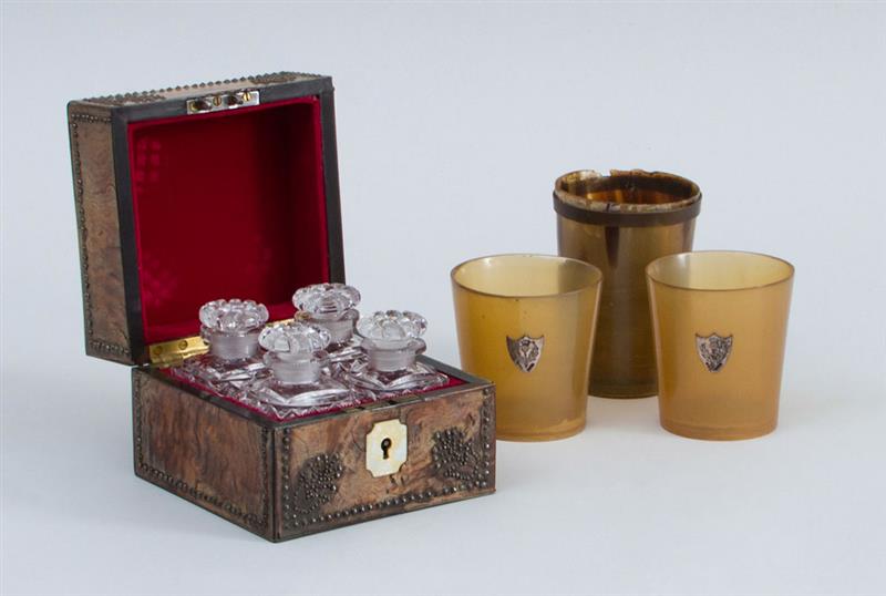 Appraisal: VICTORIAN BRASS-STUDDED ELM BOX FITTED WITH FOUR CUT-GLASS SCENT BOTTLES