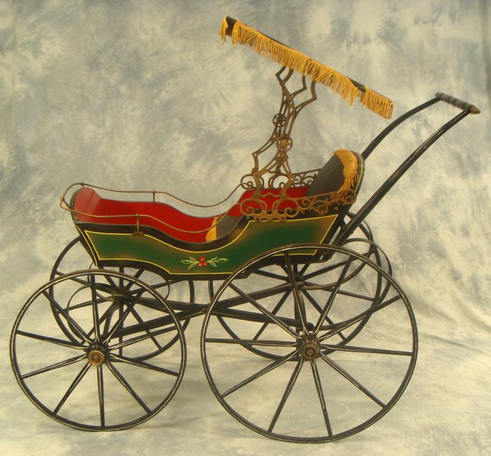 Appraisal: Victorian baby carriage beautifully restored green black and gold painted