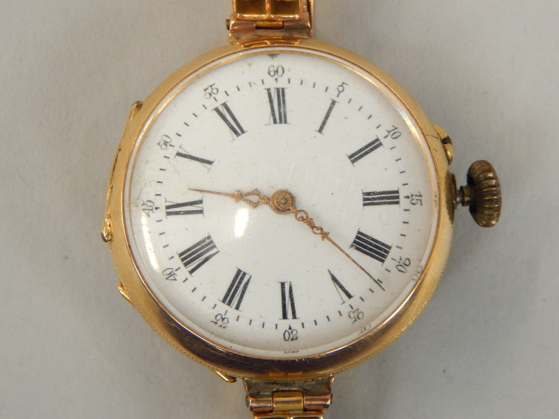 Appraisal: A ct gold ladies wristwatch with white enamel circular dial