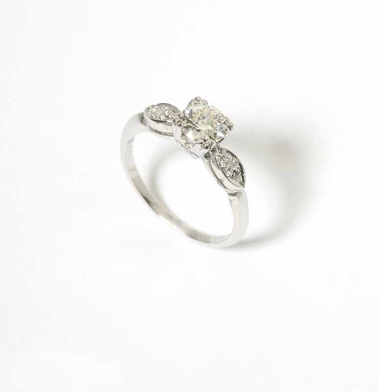 Appraisal: A diamond and platinum ring Centering an old European-cut diamond