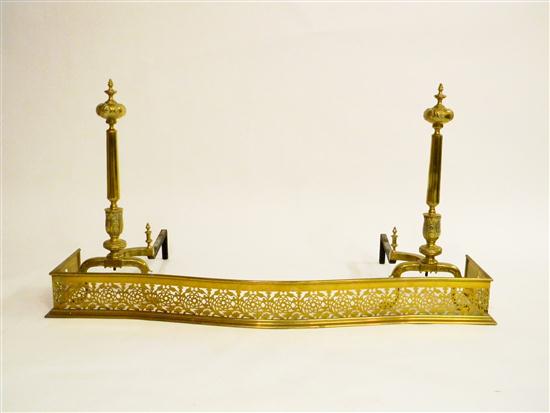 Appraisal: Brass reticulated fireplace fender with floral design and serpentine form