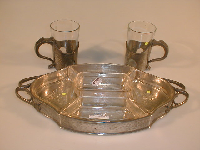 Appraisal: A pewter and glass hors d'oeuvres tray with Art Nouveau