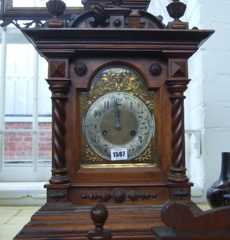 Appraisal: A late Victorian walnut mantel clock with Gothic architectural case