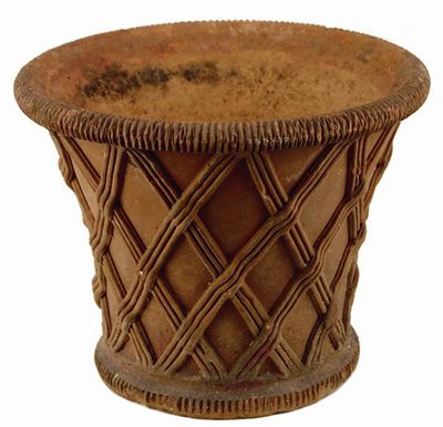 Appraisal: A terracotta cachepot with lattice decoration stamped 'JOHN MATTHEWS WESTON-SUPER-MARE'