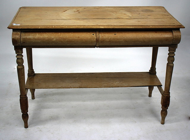 Appraisal: A PINE SIDE TABLE with two frieze drawers standing on