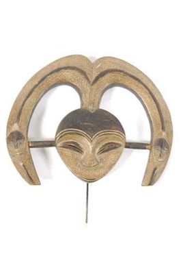 Appraisal: A Kwele mask with a hart shape face and curved