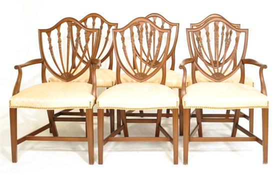 Appraisal: Six Hepplewhite style chairs mahogany shield back with carved wheat