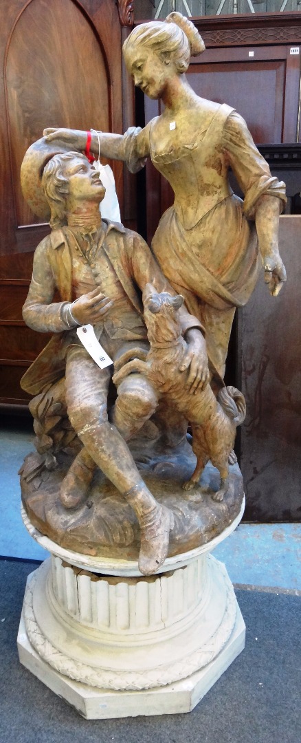 Appraisal: A th century terracotta group of a pastoral couple on