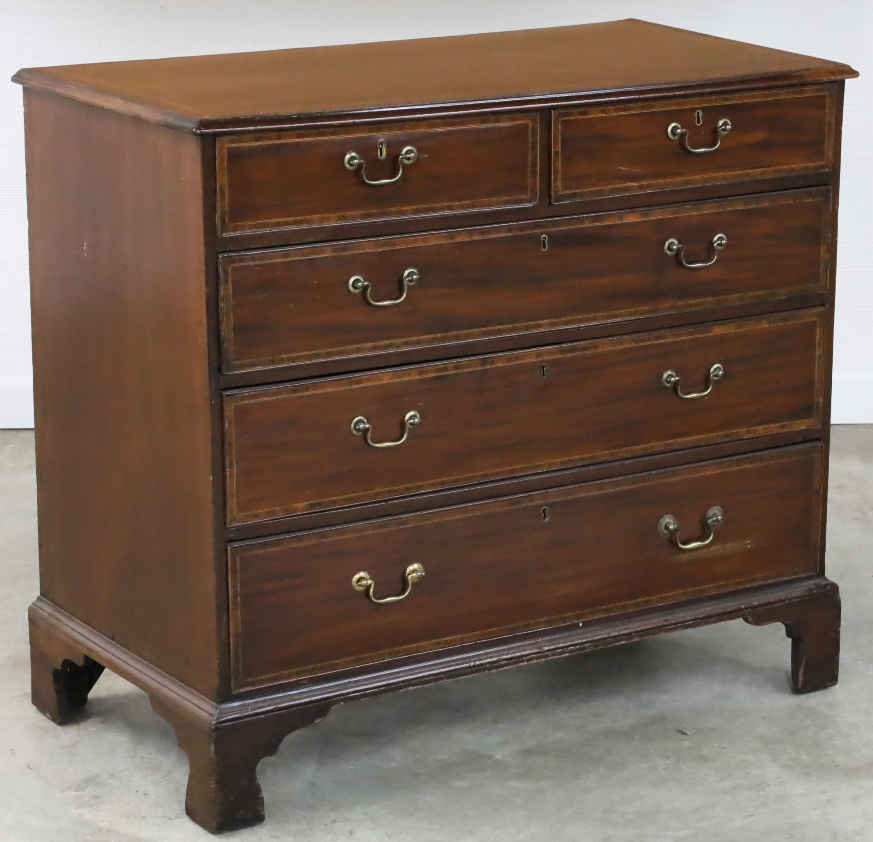 Appraisal: GEORGIAN MAHOGANY CROSSBANDED CHEST Georgian mahogany five drawer chest with