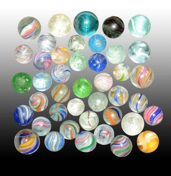 Appraisal: Lot of Assorted Handmade Marbles Description Includes some swirls onion