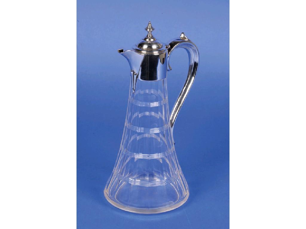 Appraisal: A SILVER MOUNTED CLARET JUG of faceted form with scroll