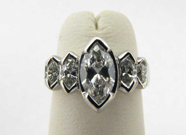 Appraisal: Platinum Five Graduated Marquise Diamond Ring center stone is approximately