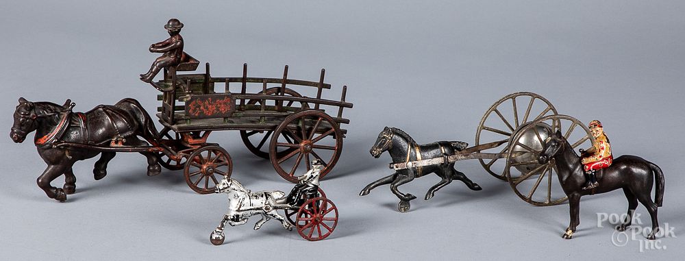 Appraisal: Four cast iron toys Four cast iron toys to include