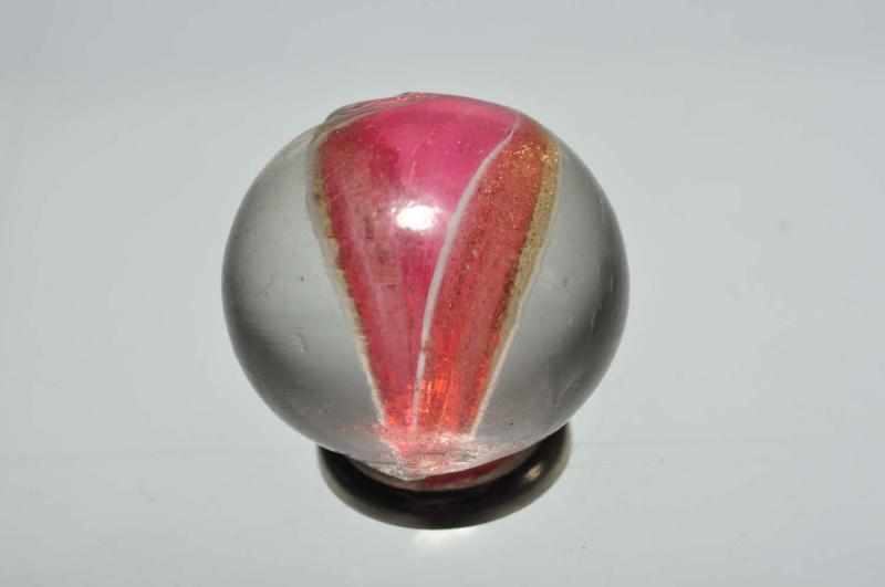 Appraisal: Cranberry Ribbon Lutz Marble Description Translucent cranberry ribbon with lutz