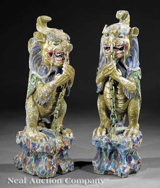 Appraisal: A Pair of Chinese Polychrome Painted Carved Wood Guardian Dragons