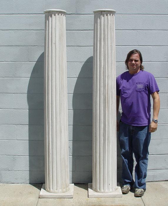 Appraisal: PAIR FLUTED ARCHITECTURAL WOOD COLUMNS Capped with round top square